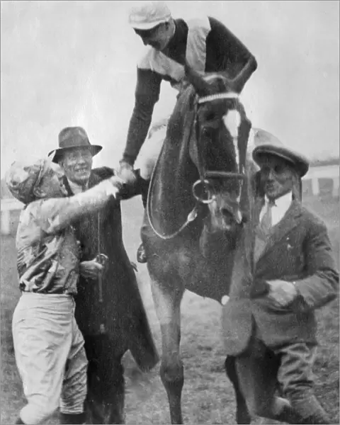 Jockey Tommy Cullinan is congratulated after winning the 1930 Grand National