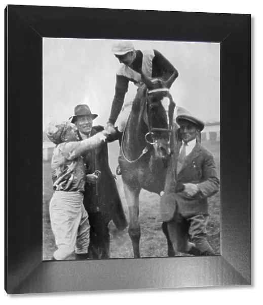 Jockey Tommy Cullinan is congratulated after winning the 1930 Grand National