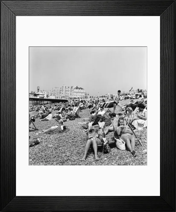 Framed Print : Crowded scenes on Brighton Beach as holidaymakers enjoy the hot summer weather Framed Print : Crowded scenes on Brighton Beach as holidaymakers enjoy the hot summer weather