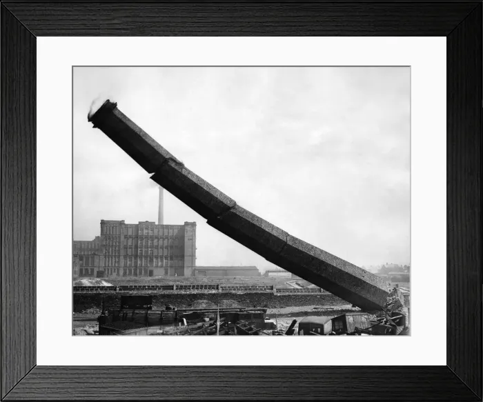 Framed Print : Built nearly a century ago, this derelict mill chimney crashed to earth today Framed Print : Built nearly a century ago, this derelict mill chimney crashed to earth today