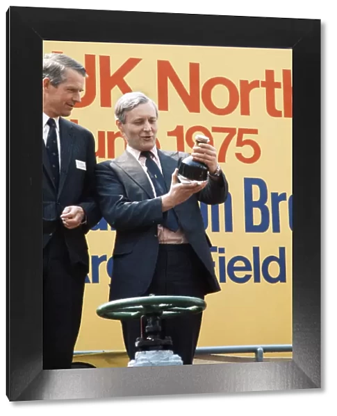 Labour Secretary of State for Energy Tony Benn pictured with bottle of oil