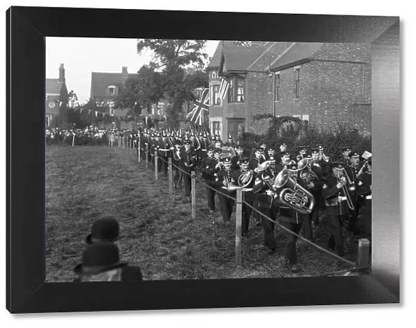 Nuneaton volunteers march off behind the battalion band of the Royal Warwickshire