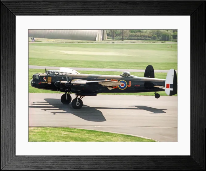 Framed Print : A Second World War Avro Lancaster bomber pictured leaving RAF St Athan after a refit