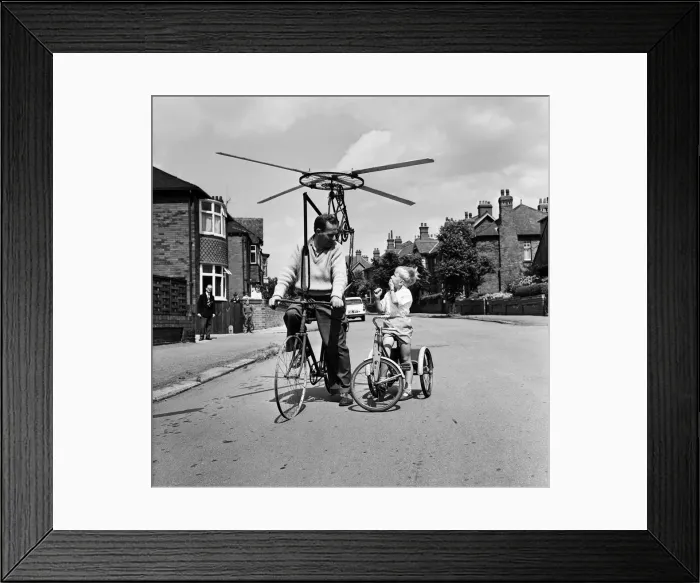 Framed Print : Mr Clifford Davis of Leeds Road Wakefield, tries out his flying machine made from bits of Framed Print : Mr Clifford Davis of Leeds Road Wakefield, tries out his flying machine made from bits of