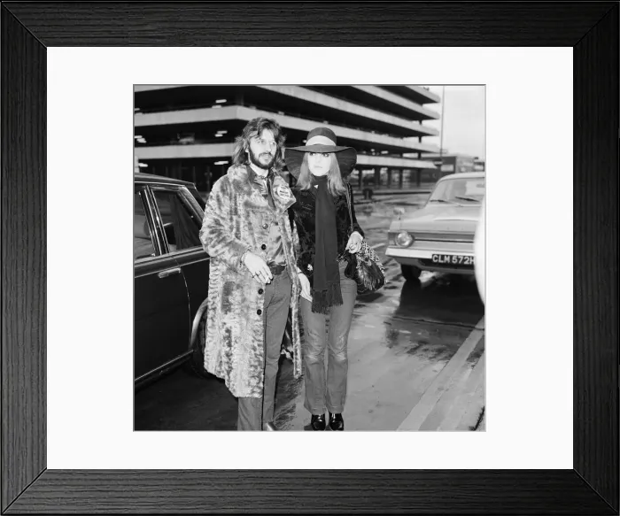 Framed Print : Former Beatles drummer Ringo Starr at Heathrow airport with his wife Maureen en route Framed Print : Former Beatles drummer Ringo Starr at Heathrow airport with his wife Maureen en route