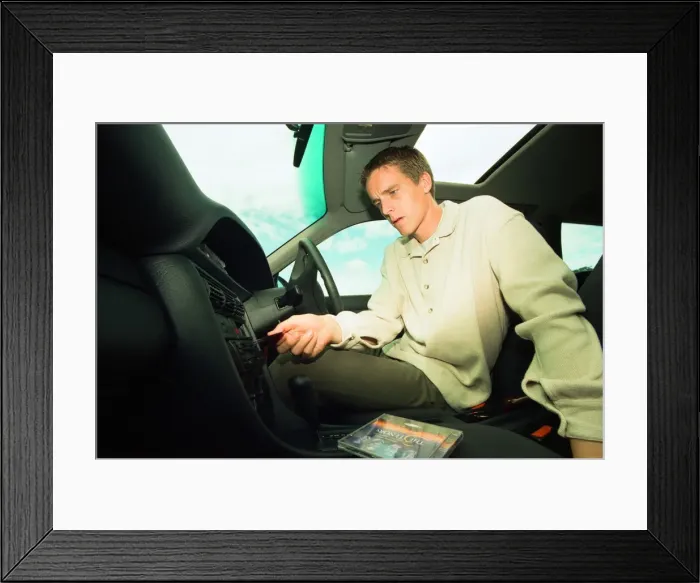 Framed Print : Middlesbroughs Jan Aage Fjortoft listening to an Opera CD in his Audi estate car Framed Print : Middlesbroughs Jan Aage Fjortoft listening to an Opera CD in his Audi estate car