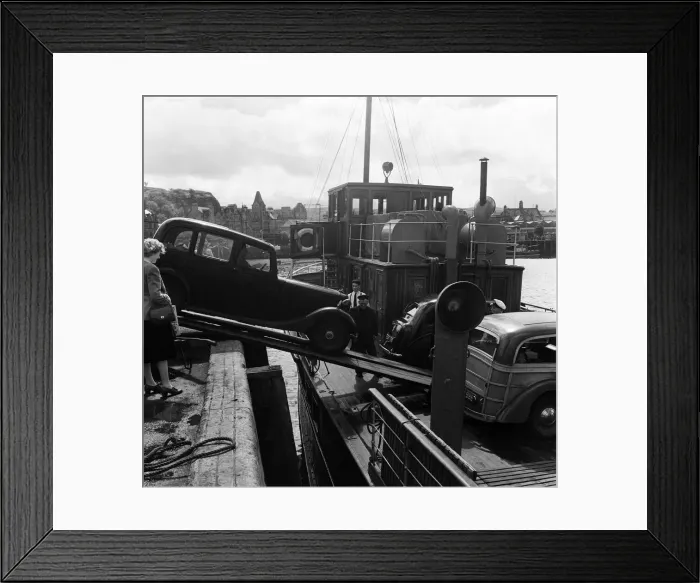 Framed Print : Loading a car onto a ferry steamer at the Quay at Oban. Oban is a resort town within Framed Print : Loading a car onto a ferry steamer at the Quay at Oban. Oban is a resort town within