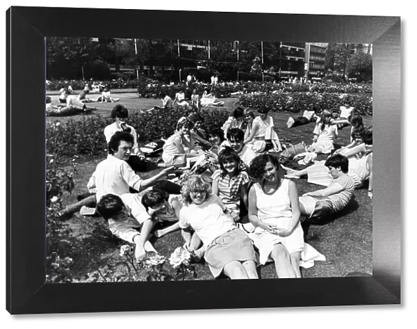 Sun worshippers in Victoria Square, Middlesbrough, during lunch time. 27th July 1983