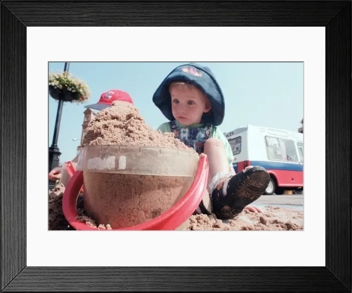 Framed Print : Children from Kids & Co. Nursery spend the morning playing with the sand in Framed Print : Children from Kids & Co. Nursery spend the morning playing with the sand in
