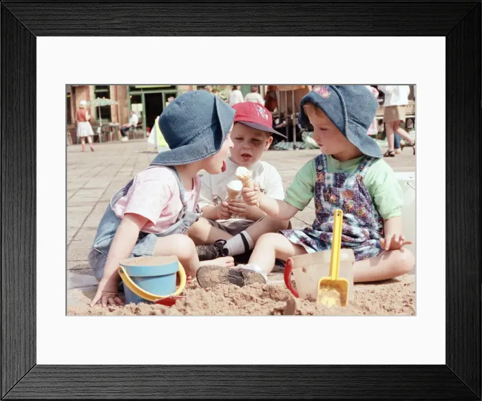 Framed Print : Children from Kids & Co. Nursery spend the morning playing with the sand in Framed Print : Children from Kids & Co. Nursery spend the morning playing with the sand in