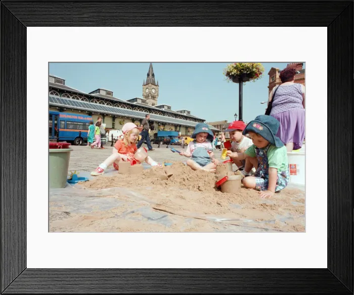 Framed Print : Children from Kids & Co. Nursery spend the morning playing with the sand in