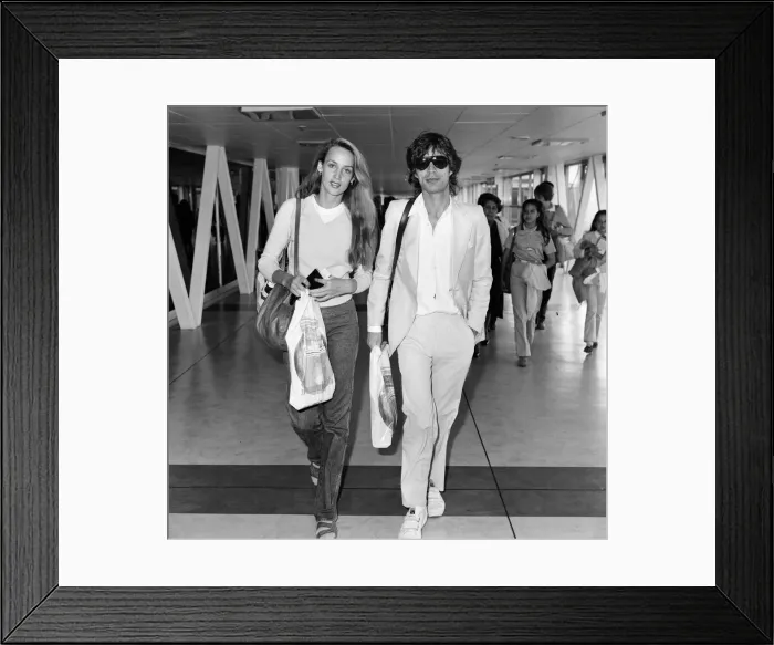 Framed Print : Mick Jagger and girlfriend, model, Jerry Hall, pictured at London Heathrow Airport Framed Print : Mick Jagger and girlfriend, model, Jerry Hall, pictured at London Heathrow Airport