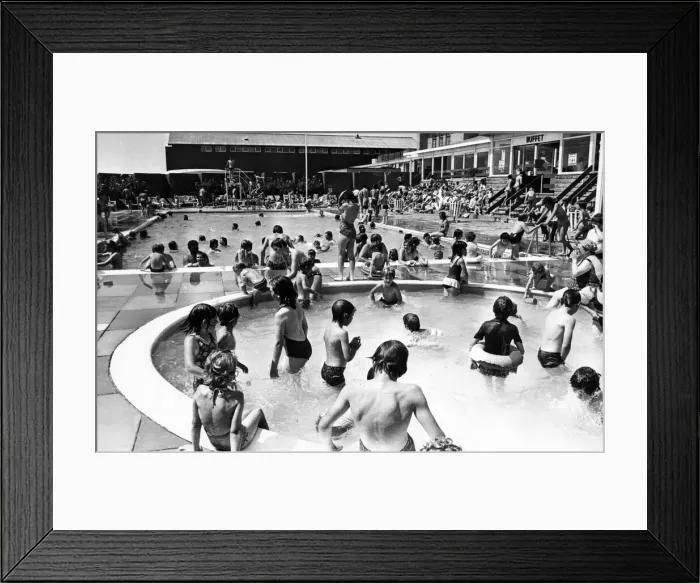 Framed Print : Holiday makers enjoy the Swimming and Paddling Pools at Trecco Bay, Porthcawl, Bridgend Framed Print : Holiday makers enjoy the Swimming and Paddling Pools at Trecco Bay, Porthcawl, Bridgend