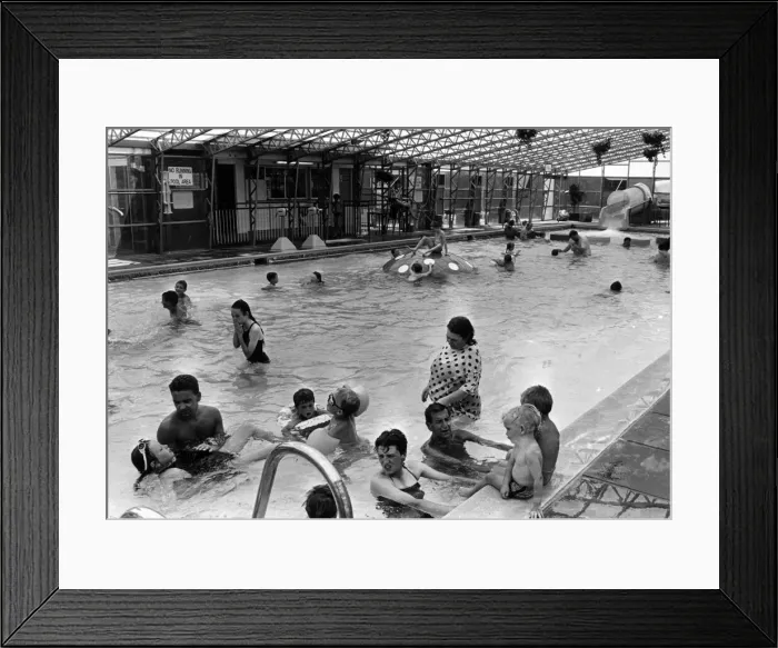 Framed Print : Holiday makers enjoy the Swimming Pool at the Sun Centre, Trecco Bay, Porthcawl, Bridgend Framed Print : Holiday makers enjoy the Swimming Pool at the Sun Centre, Trecco Bay, Porthcawl, Bridgend