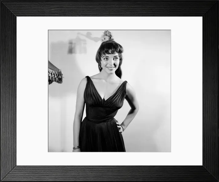Framed Print : Joan Collins, actress, aged 22, pictured wearing black silk cocktail dress