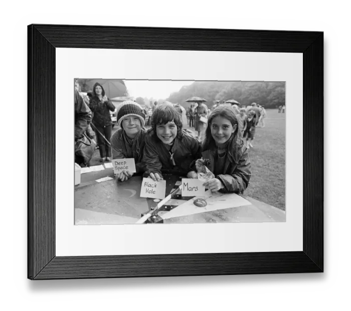 Framed Print : Playing the planet game'at a rain soaked Brighouse Fun Day were (from left Framed Print : Playing the planet game'at a rain soaked Brighouse Fun Day were (from left