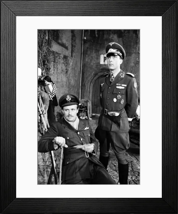 Framed Print : Actors David McCallum (left) and Anthony Valentine on the film set during filming of