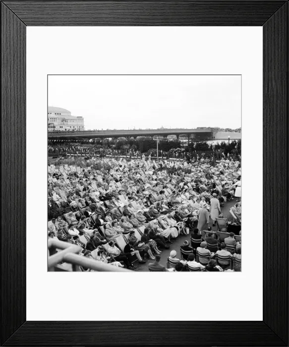 Framed Print : Southport, Merseyside, crowds of people relax in the Floral Hall Gardens as they listen Framed Print : Southport, Merseyside, crowds of people relax in the Floral Hall Gardens as they listen