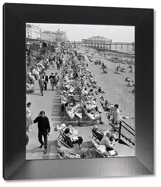 Whitsunday holiday scenes, with the pier in the background, in Eastbourne, Sussex