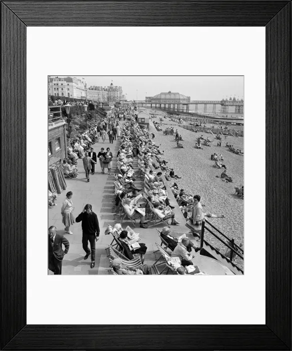 Framed Print : Whitsunday holiday scenes, with the pier in the background, in Eastbourne, Sussex Framed Print : Whitsunday holiday scenes, with the pier in the background, in Eastbourne, Sussex