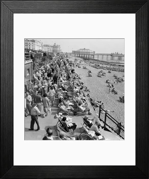 Framed Print : Whitsunday holiday scenes, with the pier in the background, in Eastbourne, Sussex Framed Print : Whitsunday holiday scenes, with the pier in the background, in Eastbourne, Sussex
