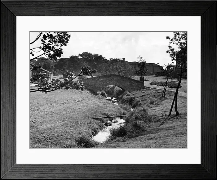 Framed Print : A touch of the ancient among the modern at Guisborough is this packhorse-type bridge over Framed Print : A touch of the ancient among the modern at Guisborough is this packhorse-type bridge over