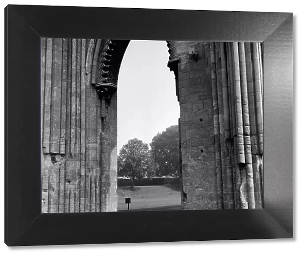 Ruins of Glastonbury Abbey in Somerset. Plaque marks the site of King Arthurs tomb