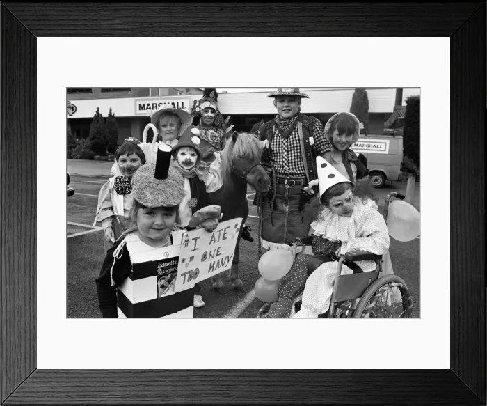 Framed Print : Three-year-old Zoe Taylor is pictured with prize-winners from the fancy dress competition