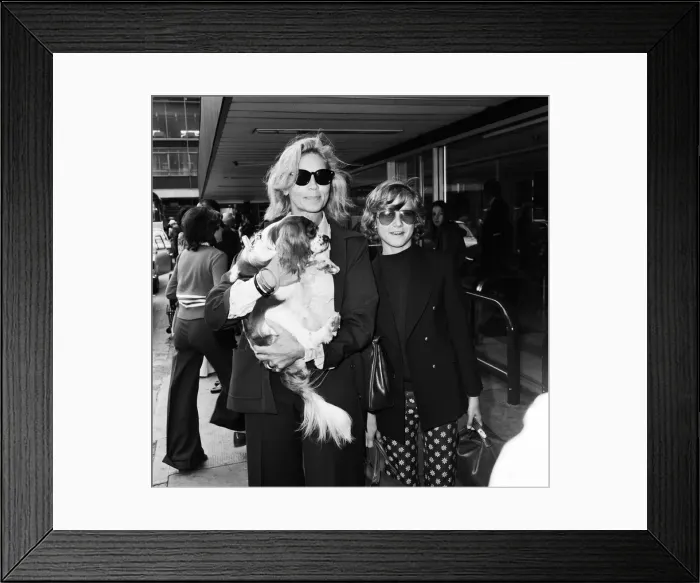 Framed Print : Actress Lauren Bacall at Heathrow Airport with her son Sam (12)