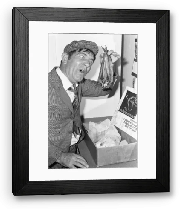 Framed Print : Comedian Norman Wisdom seen here in the persona of hapless on screen character Norman