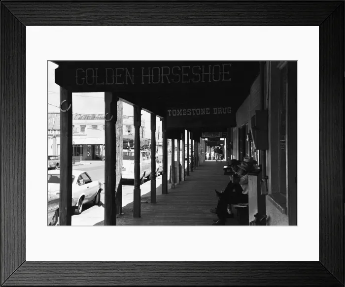 Framed Print : Three old timers sit outside the Tombstone Drug store close to the site of the famous Framed Print : Three old timers sit outside the Tombstone Drug store close to the site of the famous
