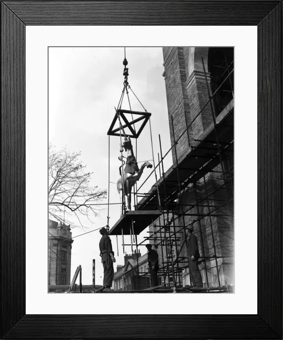 Framed Print : One of the gilded unicorns seen here being hoisted up on to the roof of Bristol City Hall Framed Print : One of the gilded unicorns seen here being hoisted up on to the roof of Bristol City Hall