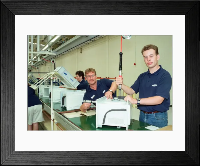 Framed Print : Workers on the pilot production line at the new Samsung factory Wynyard
