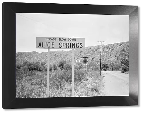 Slow down sign at the entrance to the town of Alice Springs, Australia. 1st February 1976