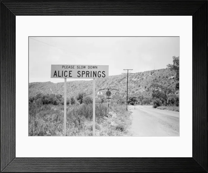 Framed Print : Slow down sign at the entrance to the town of Alice Springs, Australia. 1st February 1976 Framed Print : Slow down sign at the entrance to the town of Alice Springs, Australia. 1st February 1976