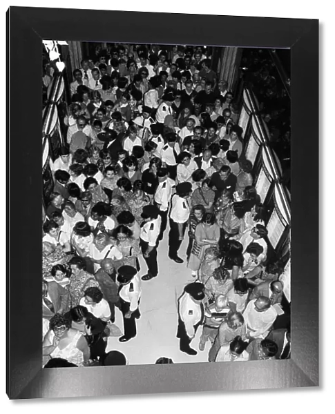 Crowds wait at the entrance to Harrods during the sale. 15th July 1979