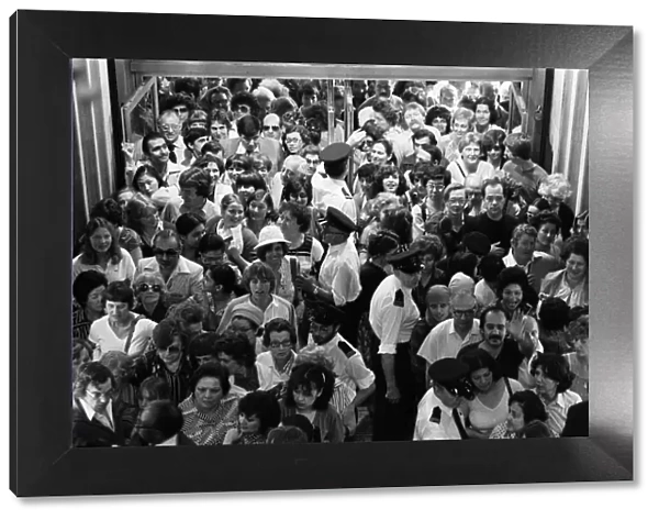 Crowds wait at the entrance to Harrods during the sale. 15th July 1979