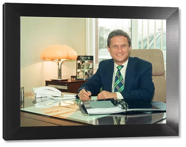 Baird Menswear, Guisborough. Mike Baker, sales director, at his desk. 13th December 1994