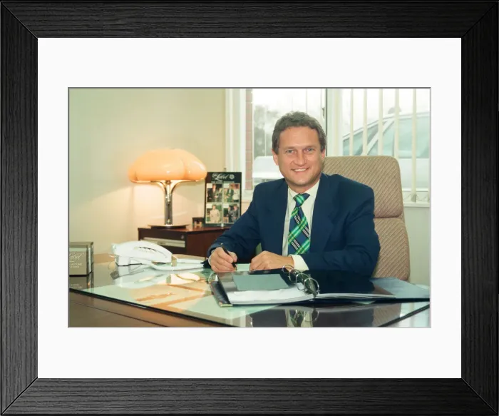 Framed Print : Baird Menswear, Guisborough. Mike Baker, sales director, at his desk. 13th December 1994 Framed Print : Baird Menswear, Guisborough. Mike Baker, sales director, at his desk. 13th December 1994
