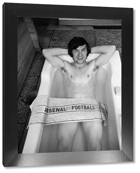 Arsenal footballer George Armstrong pictured in the bath at Highbury football ground