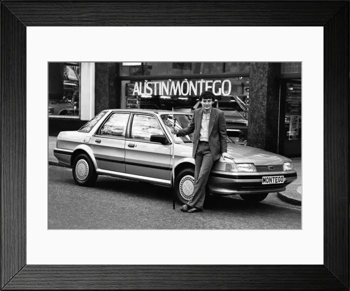 Framed Print : Snooker player Jimmy White poses beside a new model Austin Montego. 11th May 1984 Framed Print : Snooker player Jimmy White poses beside a new model Austin Montego. 11th May 1984