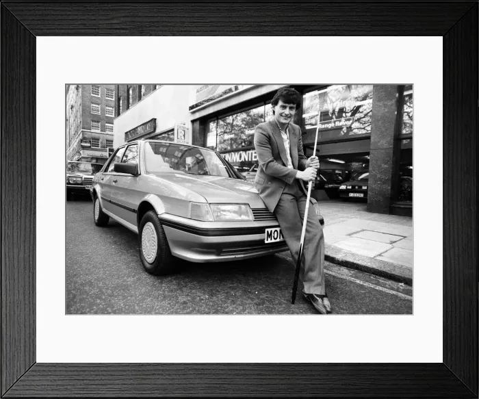Framed Print : Snooker player Jimmy White poses beside a new model Austin Montego. 11th May 1984 Framed Print : Snooker player Jimmy White poses beside a new model Austin Montego. 11th May 1984