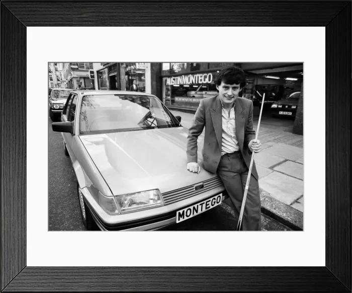 Framed Print : Snooker player Jimmy White poses beside a new model Austin Montego. 11th May 1984 Framed Print : Snooker player Jimmy White poses beside a new model Austin Montego. 11th May 1984