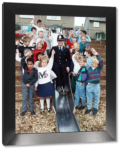 Playtime... community constable PC Adrian Denby tests the slide in Reinwood Infant