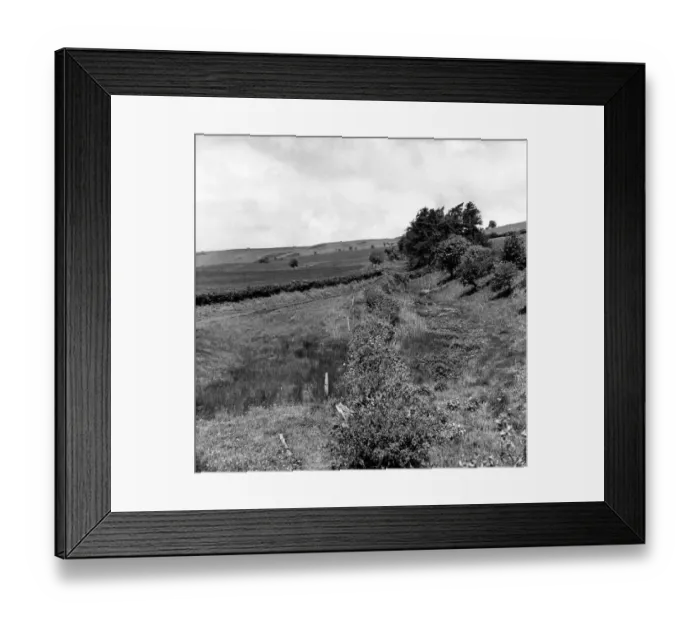 Framed Print : Offas Dyke is a large linear earthwork that roughly follows the current border