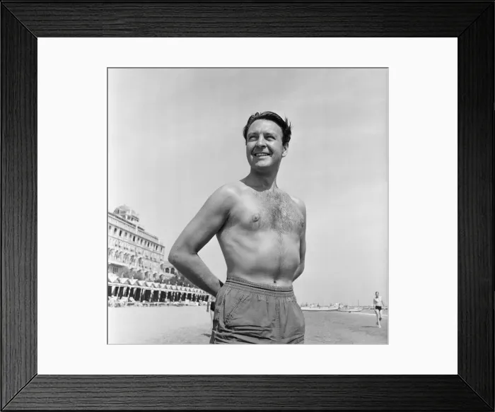 Framed Print : Donald Sinden seen here on the beach during the Venice Film Festival. 8th September 1955 Framed Print : Donald Sinden seen here on the beach during the Venice Film Festival. 8th September 1955