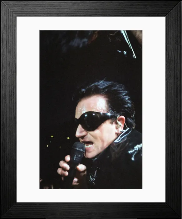 Framed Print : Rock group U2 performing on stage at Cardiff Arms Park led by singer Bono