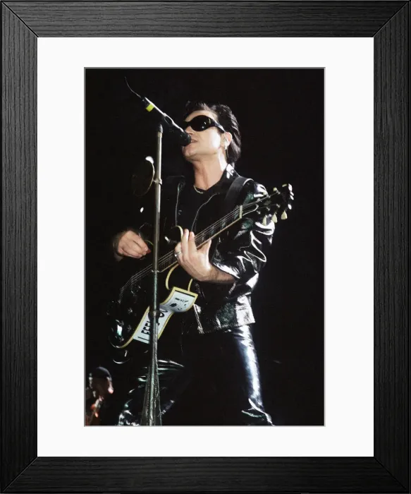 Framed Print : Rock group U2 performing on stage at Cardiff Arms Park led by singer Bono Framed Print : Rock group U2 performing on stage at Cardiff Arms Park led by singer Bono