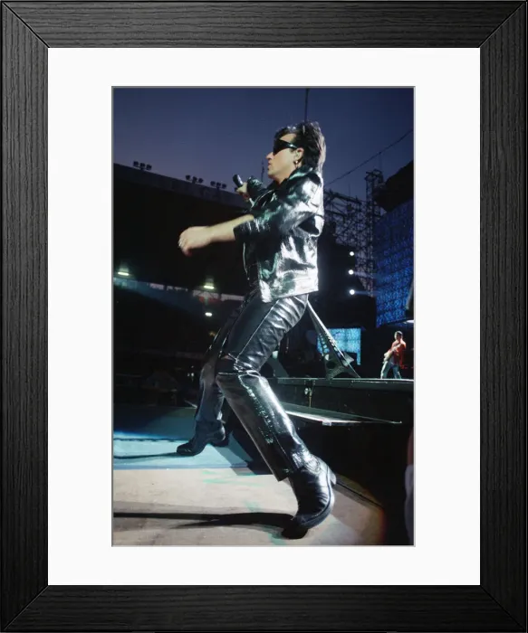 Framed Print : Rock group U2 performing on stage at Cardiff Arms Park led by singer Bono Framed Print : Rock group U2 performing on stage at Cardiff Arms Park led by singer Bono