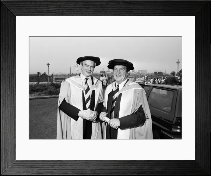 Framed Print : Former chairman of Next George Davies, shows off his robes for the degree ceremony of